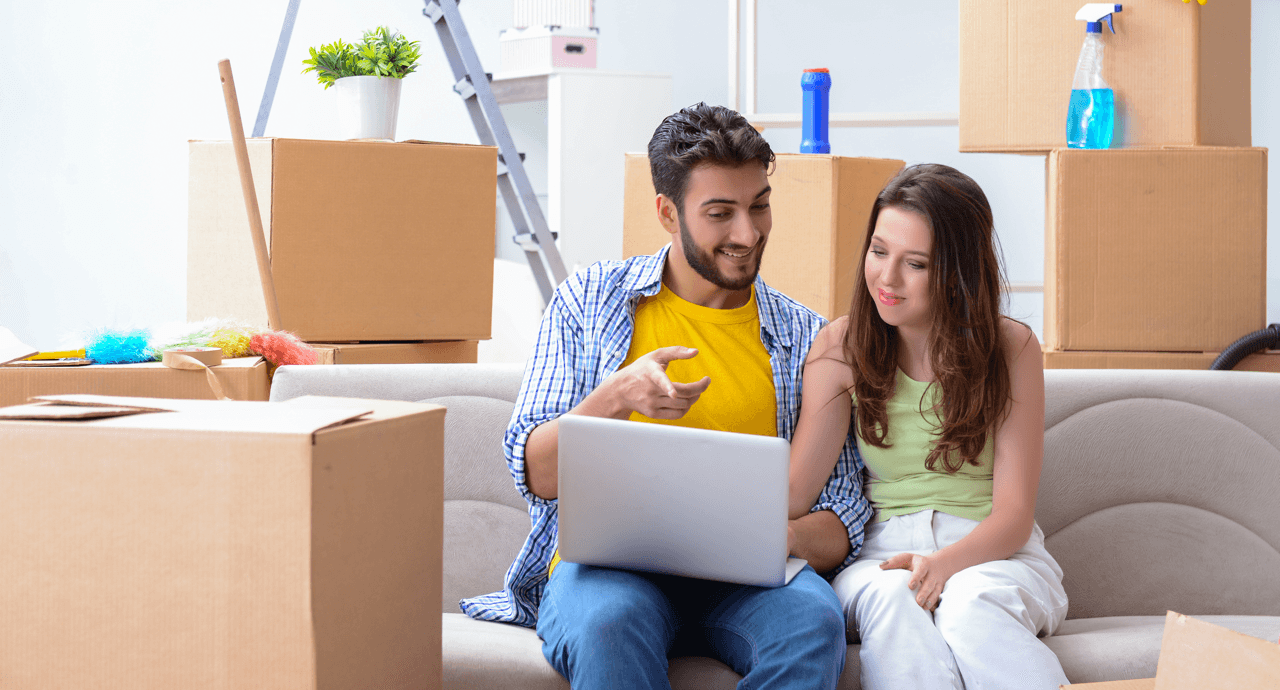 Home Buying For the First Time: Must-Have Home Items Couple Moving Image